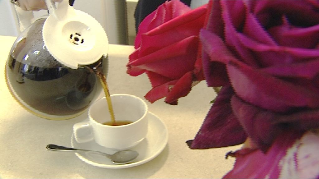 Coffee being poured into a cup